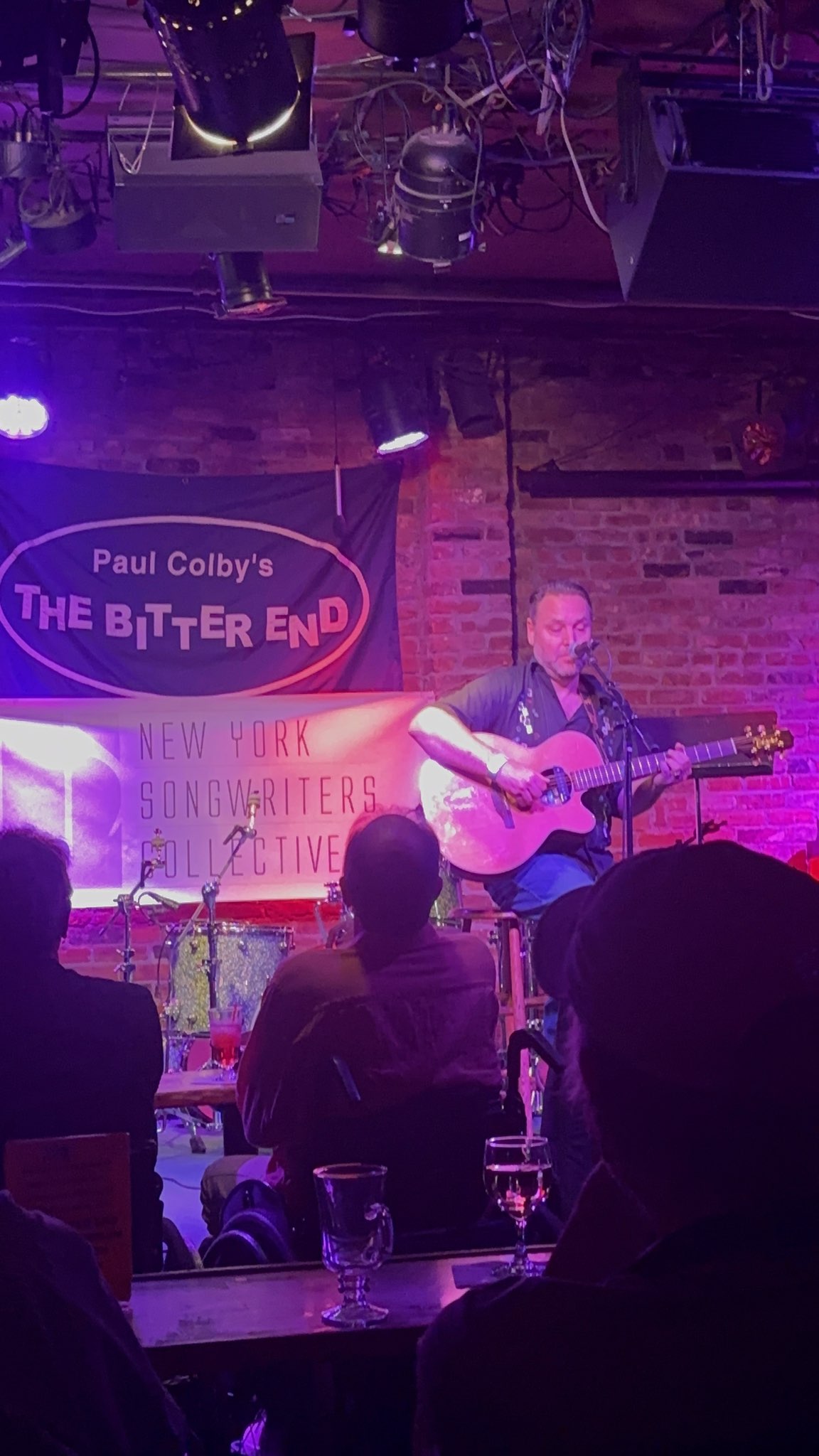 Cedar on stage at The Bitter End
